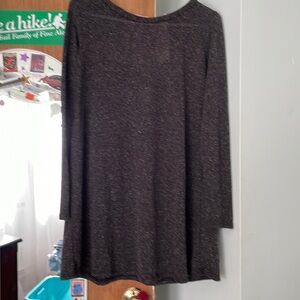 Dark gray dress with pink tie .